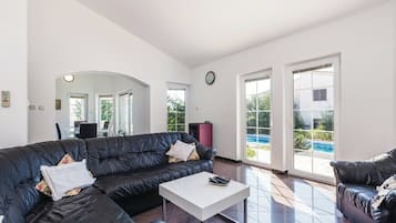 Comfort Villa, 3 Bedrooms, Pool View | Living area | 70-inch TV with digital channels