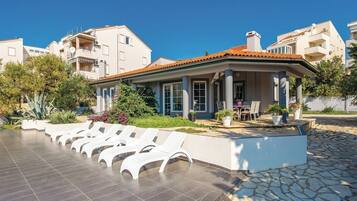 Seasonal outdoor pool, pool loungers