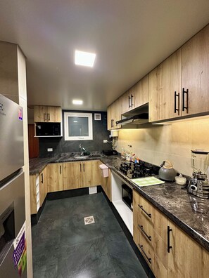 Fridge, microwave, cookware/dishes/utensils