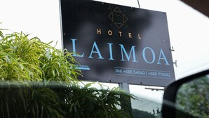 A sign for Laimao Hotel with contact numbers. - Hotel Laimoa (Apia)