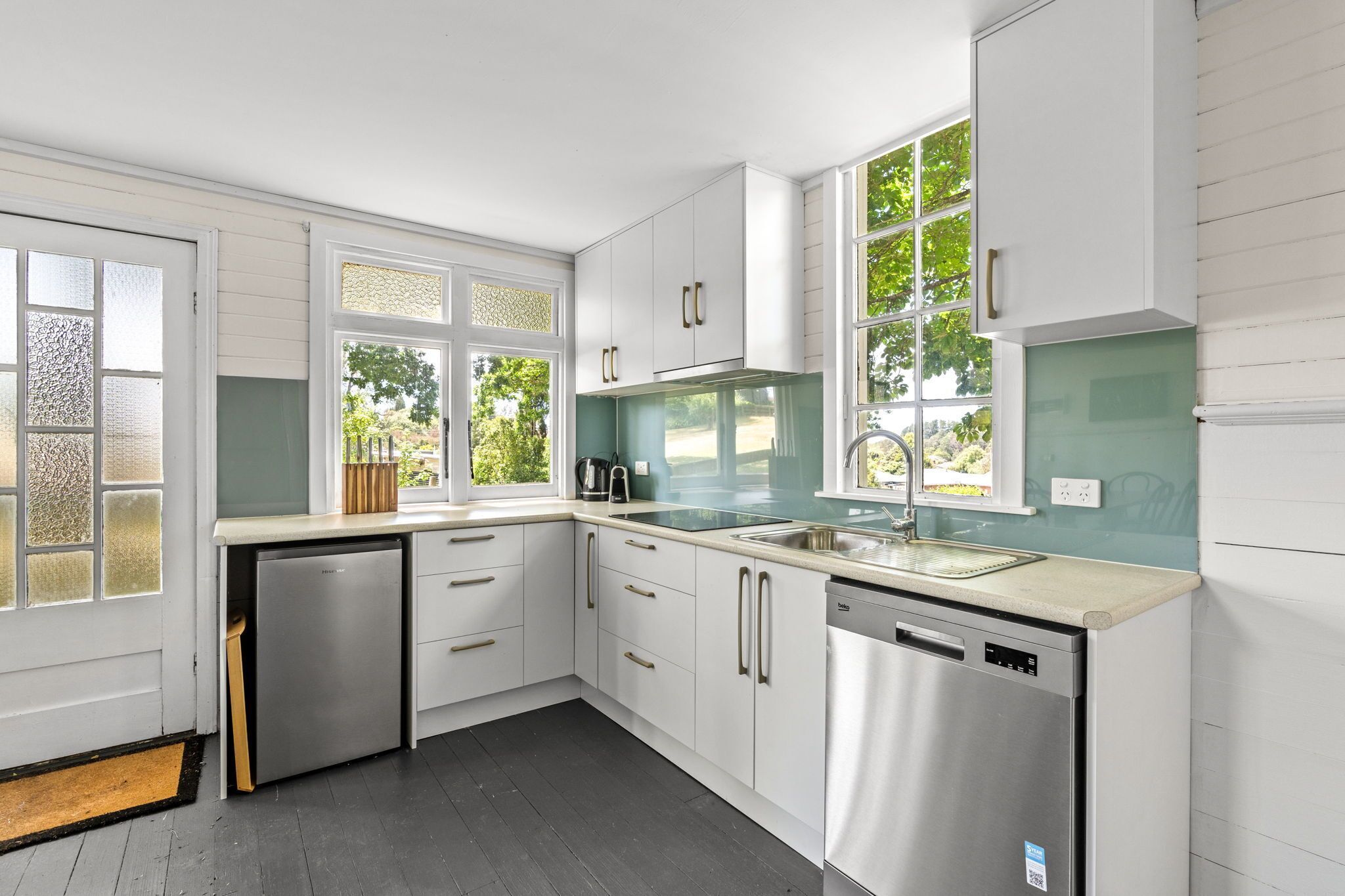 Fridge, stovetop, dishwasher, coffee/tea maker