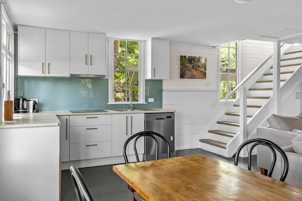 Fridge, stovetop, dishwasher, coffee/tea maker