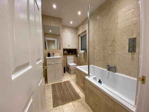 Shower, hair dryer, towels, soap