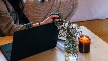 1 bedroom, desk, laptop workspace, bed sheets