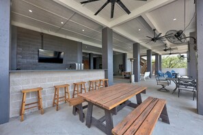 Outdoor dining - Lakefront Retreat: Swim Spa & Backyard Lake Access! Relax & Play; 2 King Suites (Lago Vista)