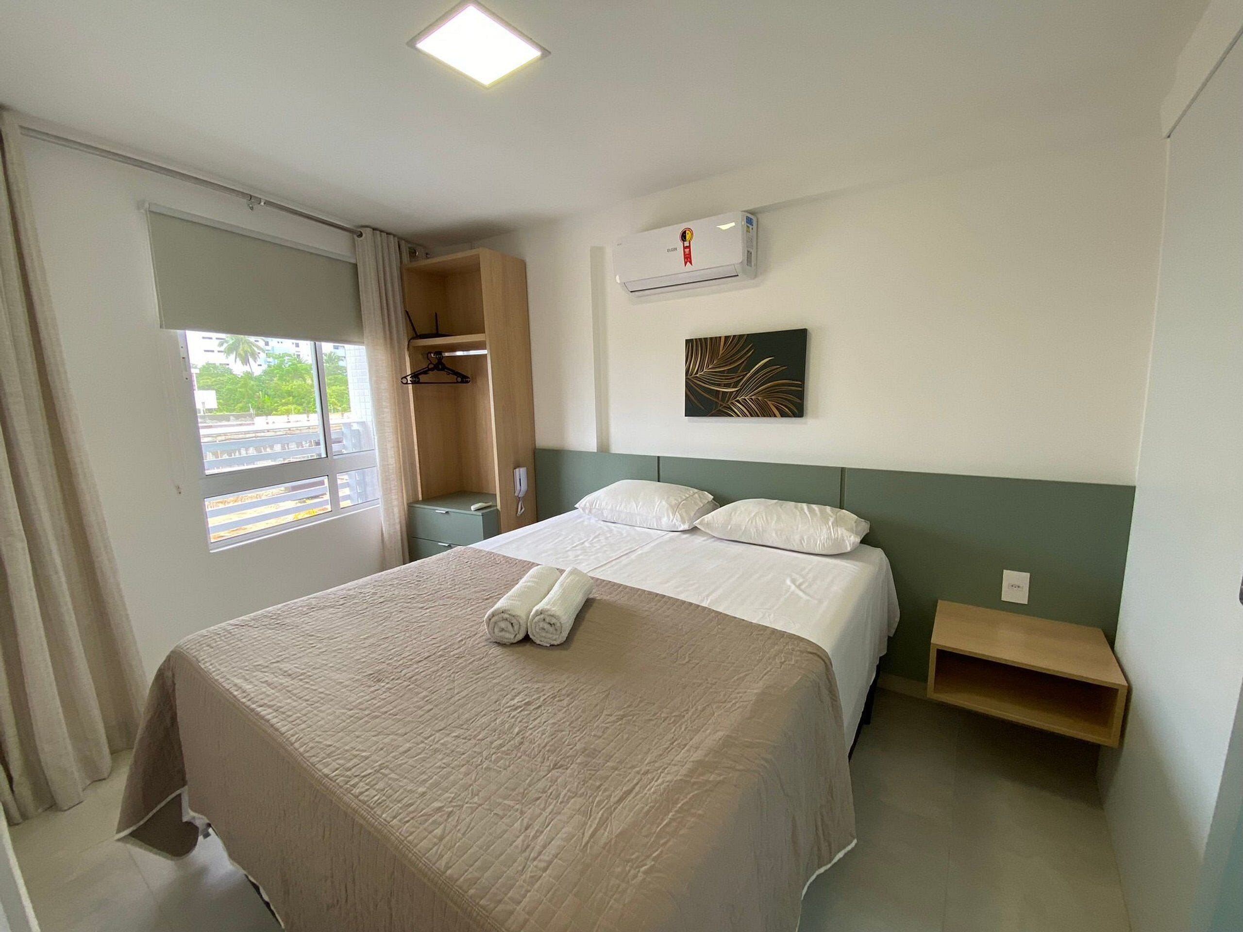 Departamento superior | Tabla de planchar con plancha, wifi gratis y ropa de cama 