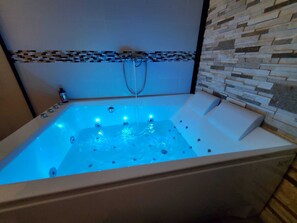 Jetted tub, hair dryer, towels, soap