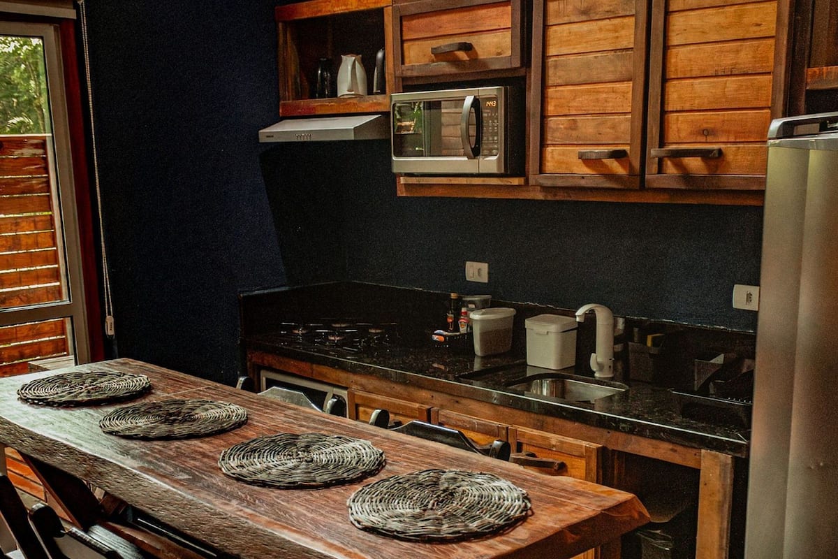 Fridge, microwave, cookware/dishes/utensils, dining tables