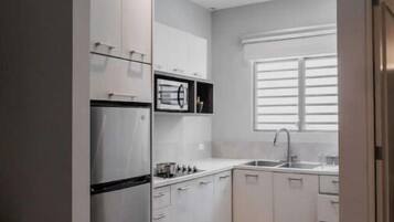Fridge, microwave, stovetop, coffee/tea maker