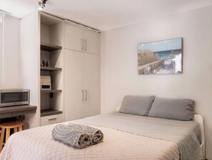 1 bedroom, desk, iron/ironing board, travel cot