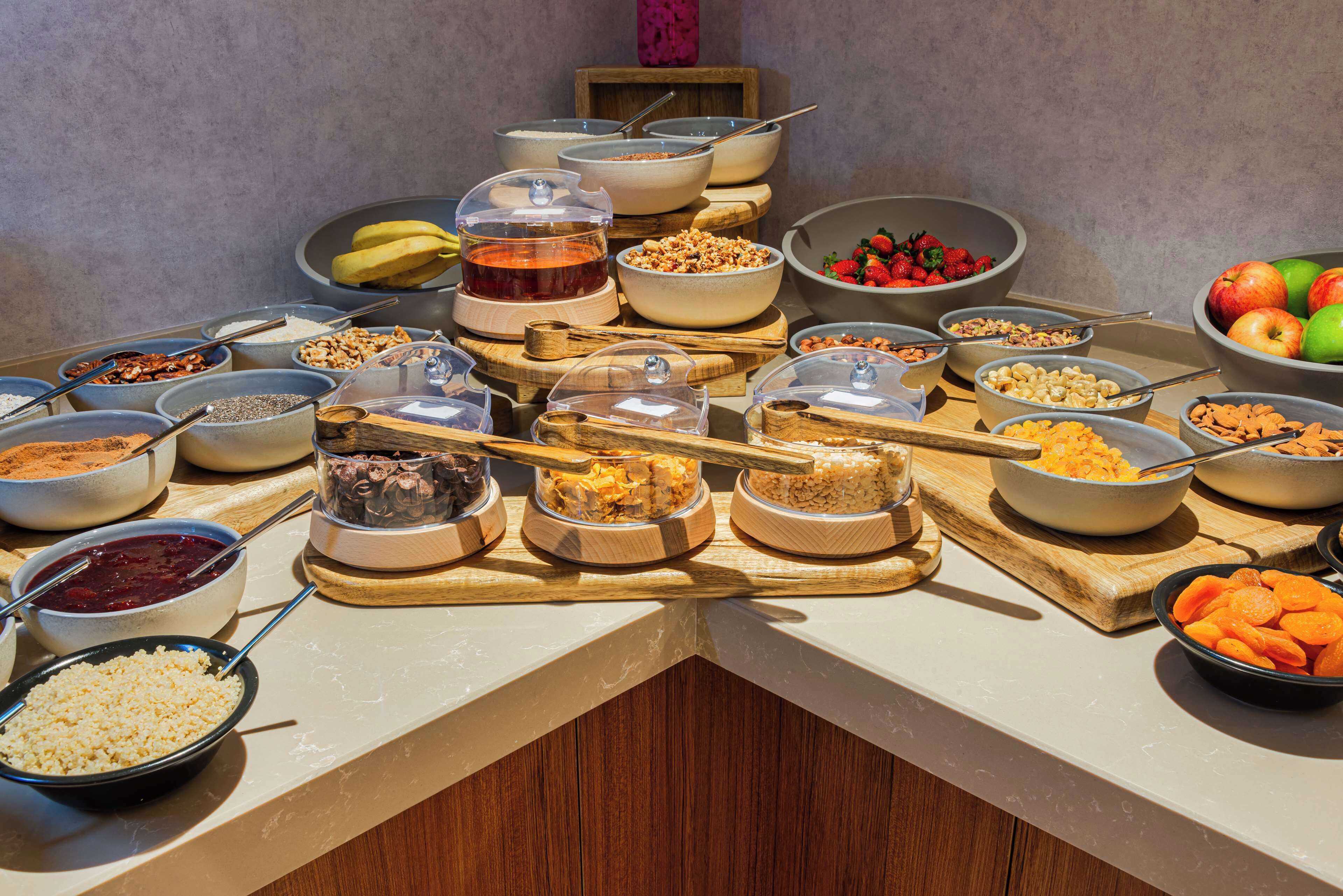 A buffet with various food items and containers.