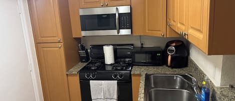 Fridge, microwave, coffee/tea maker, toaster