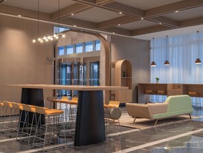 A modern lobby with a central bar area, seating arrangements, and a reception desk. - Holiday Inn Express Taizhou Toumen Port by IHG (Taizhou)