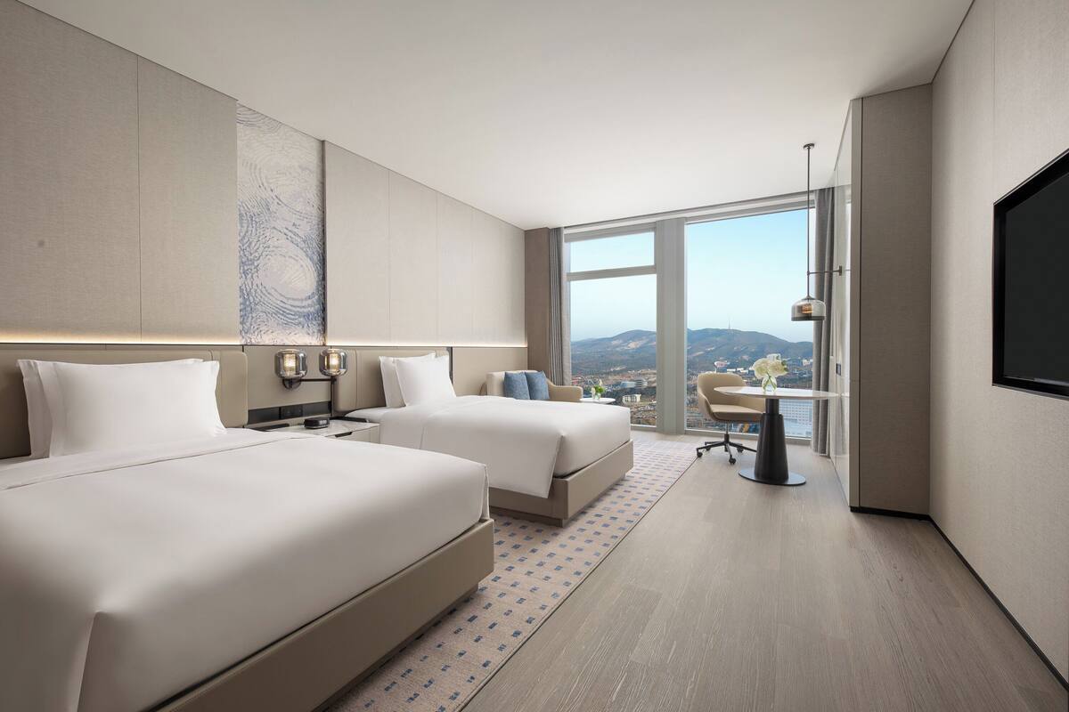 Premium bedding, memory-foam beds, desk, laptop workspace