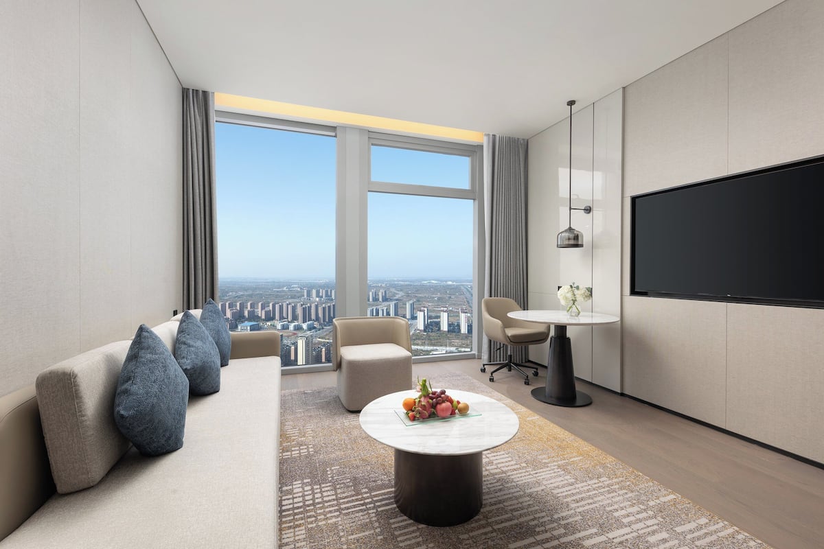 Suite, 1 Bedroom | Living room | LCD TV