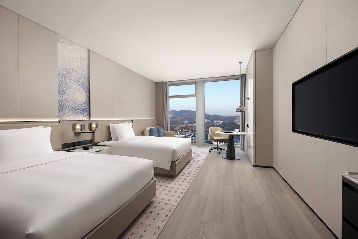 Premium bedding, memory-foam beds, desk, laptop workspace