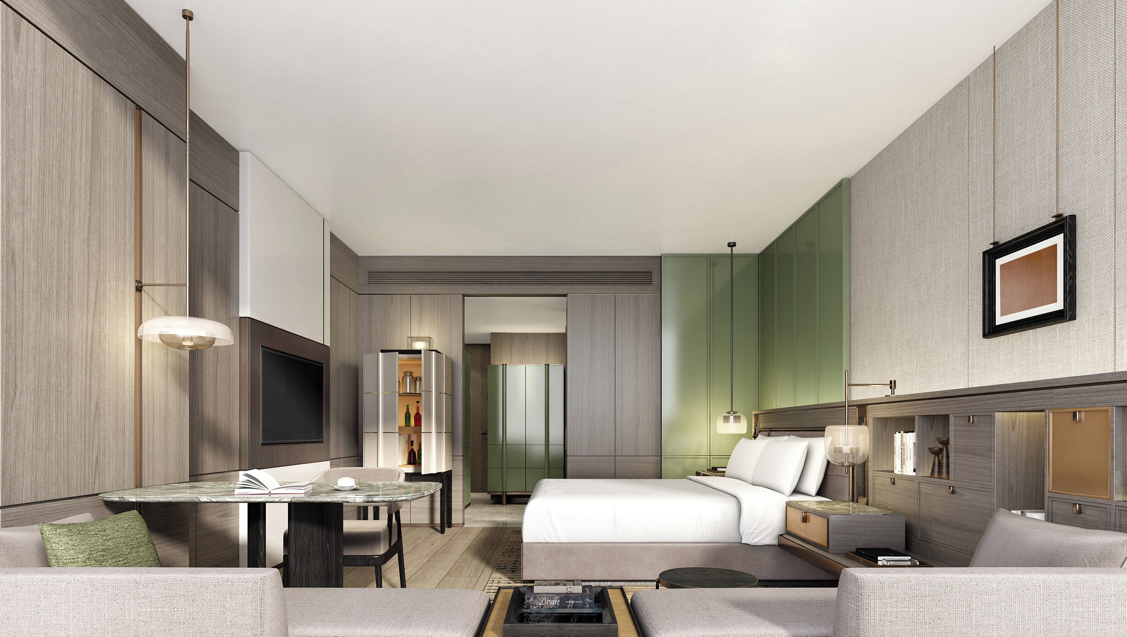 Et moderne hotelværelse med seng, skrivebord og siddeplads.