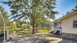 A house with a dock and a pond. - Walk to Marina! Prosperity Home w/ Screened Porch (Prosperity)