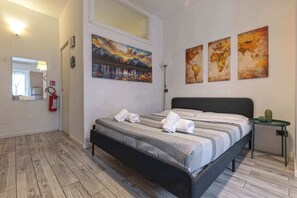 1 bedroom, desk, iron/ironing board, travel crib