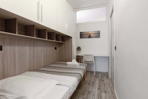 1 bedroom, desk, iron/ironing board, travel crib