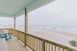 A wooden deck with a view of the beach and ocean. - Coastal Dune 3: Oceanfront Cottage on the Sand in Nags Head! (Nags Head)