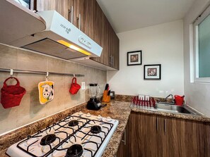 Appartement Confort, patio | Cuisine privée