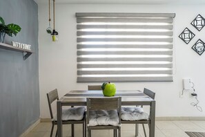 Comfort Apartment, Patio | Dining room - Poliforum Modern 2BR Modern Apartment (León)