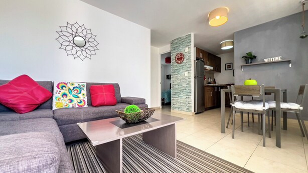 Comfort Apartment, Patio | Living area | TV - Poliforum Modern 2BR Modern Apartment (León)