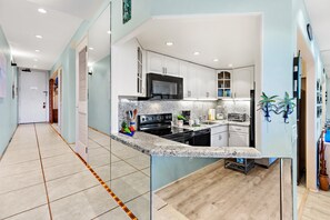 Prepare vacation meals in the well equipped kitchen with everything you need for convenient dining.