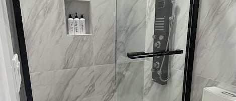 Shower, hair dryer, towels, toilet paper