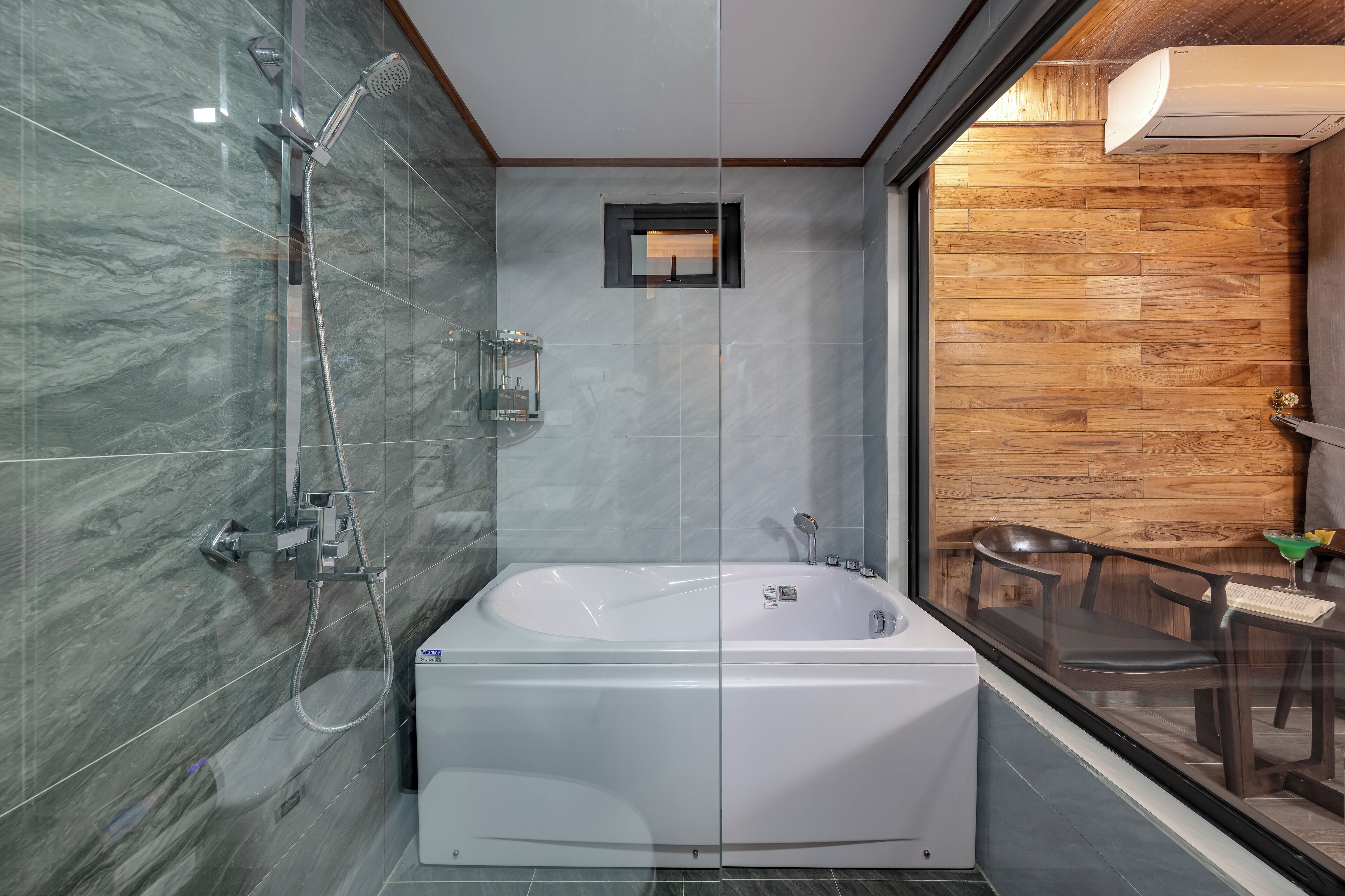 A modern bathroom with a glass-enclosed shower, a freestanding bathtub, and a wooden wall panel.