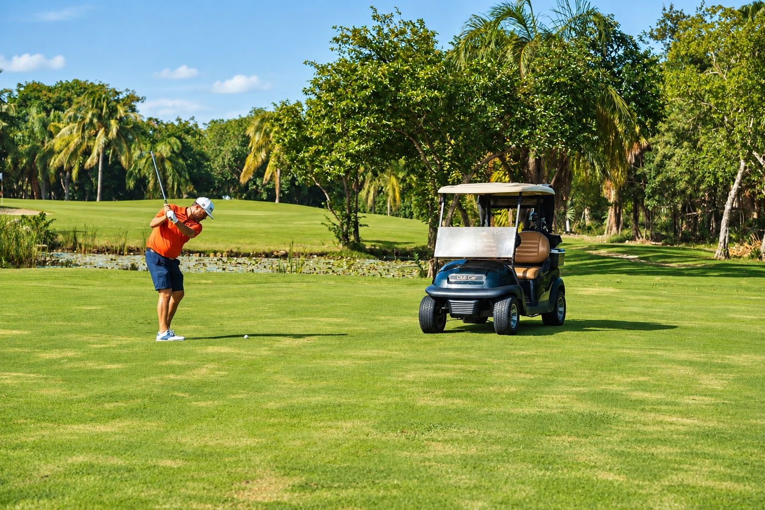 A golf course with a person in a red shirt and blue shorts preparing to hit a golf ball, and a golf cart labeled 'Club Car' parked on the grass.