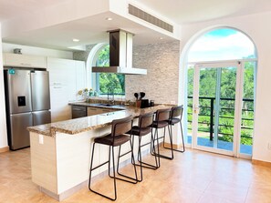 Deluxe Condo, Canal View | Private kitchen | Full-size fridge, microwave, oven, stovetop