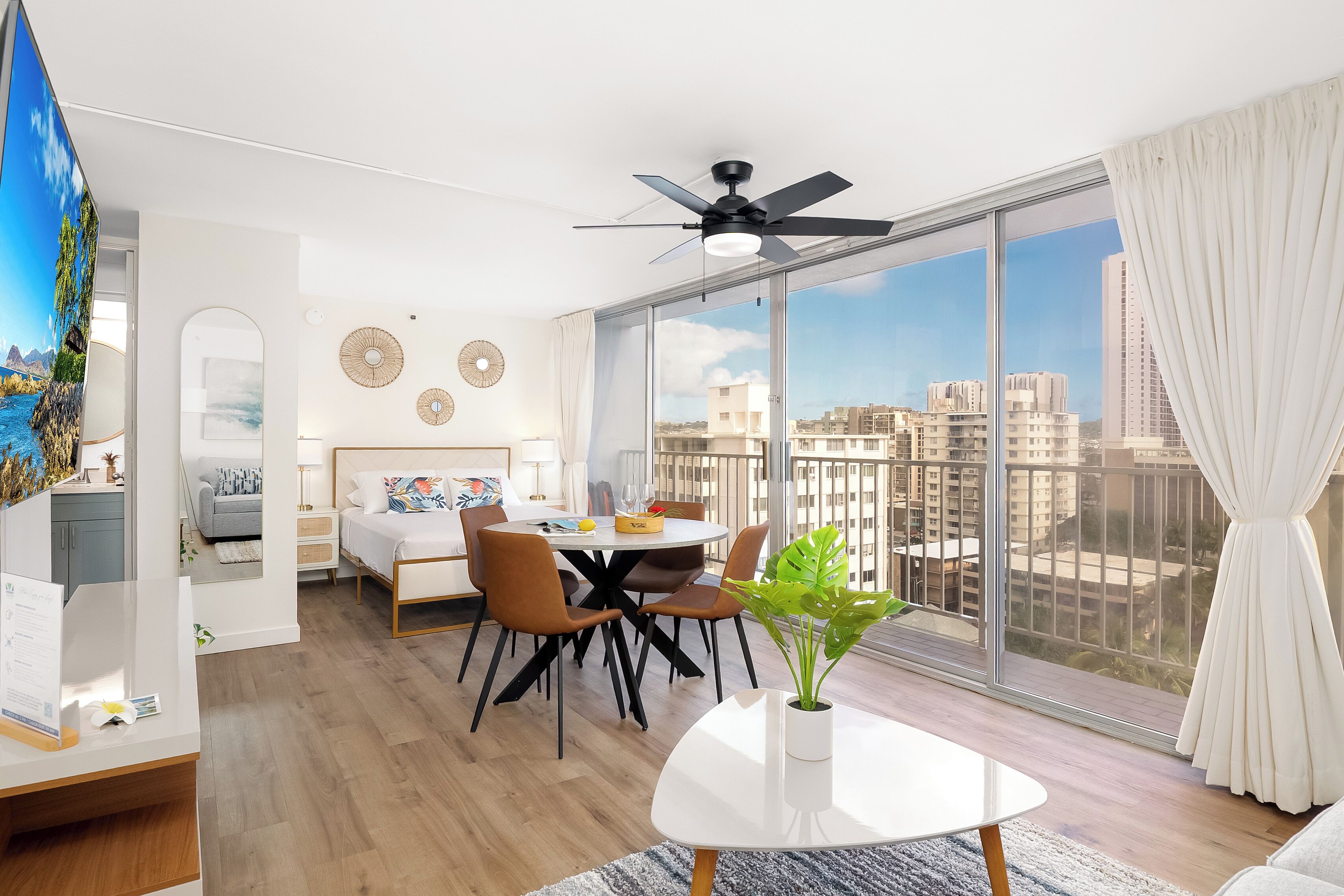 A modern living room with a dining area, large windows, and a city view.