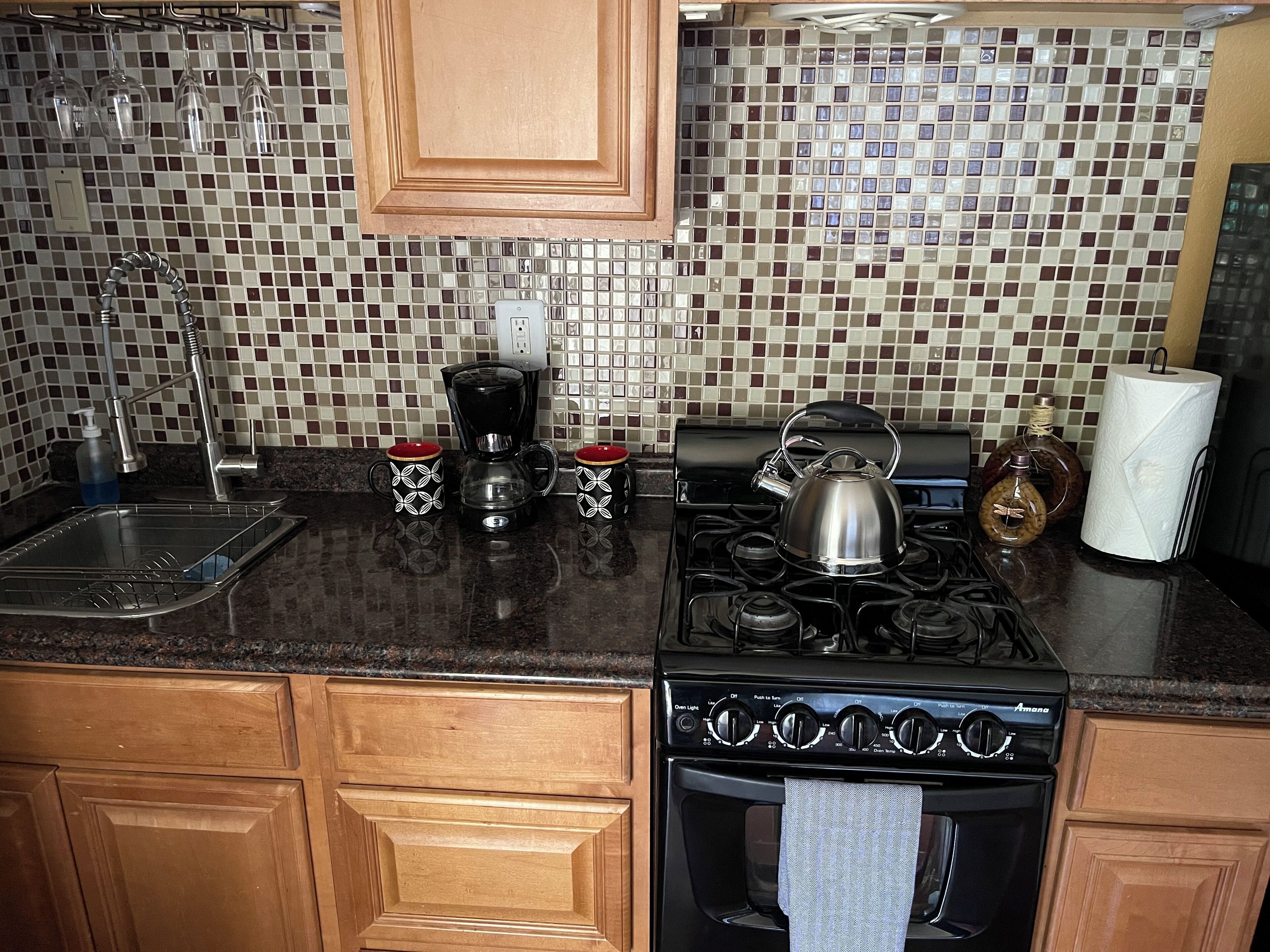 Coffee/tea maker, fridge, microwave, oven