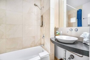 Shower, hair dryer, towels, shampoo