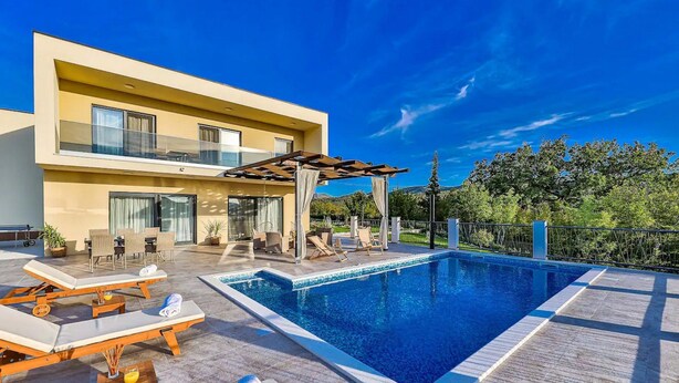 A modern two-story house with a swimming pool, outdoor seating, and a pergola. - Luxurious Sanctuary Villa Primorski Dolac With Pool (Primorski Dolac)