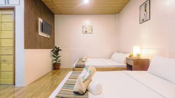 Family Room, 2 Queen Beds | Individually decorated, individually furnished, desk, laptop workspace