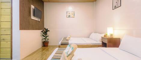 Family Room, 2 Queen Beds | Individually decorated, individually furnished, desk, laptop workspace