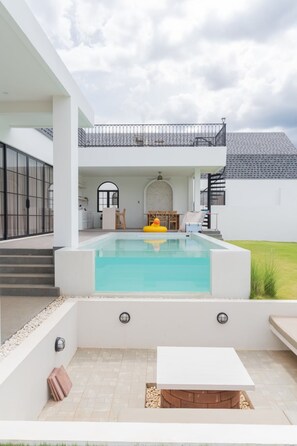Family Villa, Pool View | Living area | 32-inch flat-screen TV with cable channels