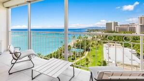 A balcony with a view of the ocean and cityscape. - 1 Bedroom Suite with Breathtaking Ocean Views! Waikiki Shore 1210 (HONOLULU)