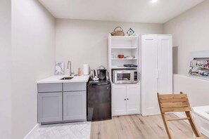 Fridge, microwave, coffee/tea maker, dining tables