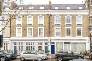 Rows of charming houses with uniform architecture and white window frames.