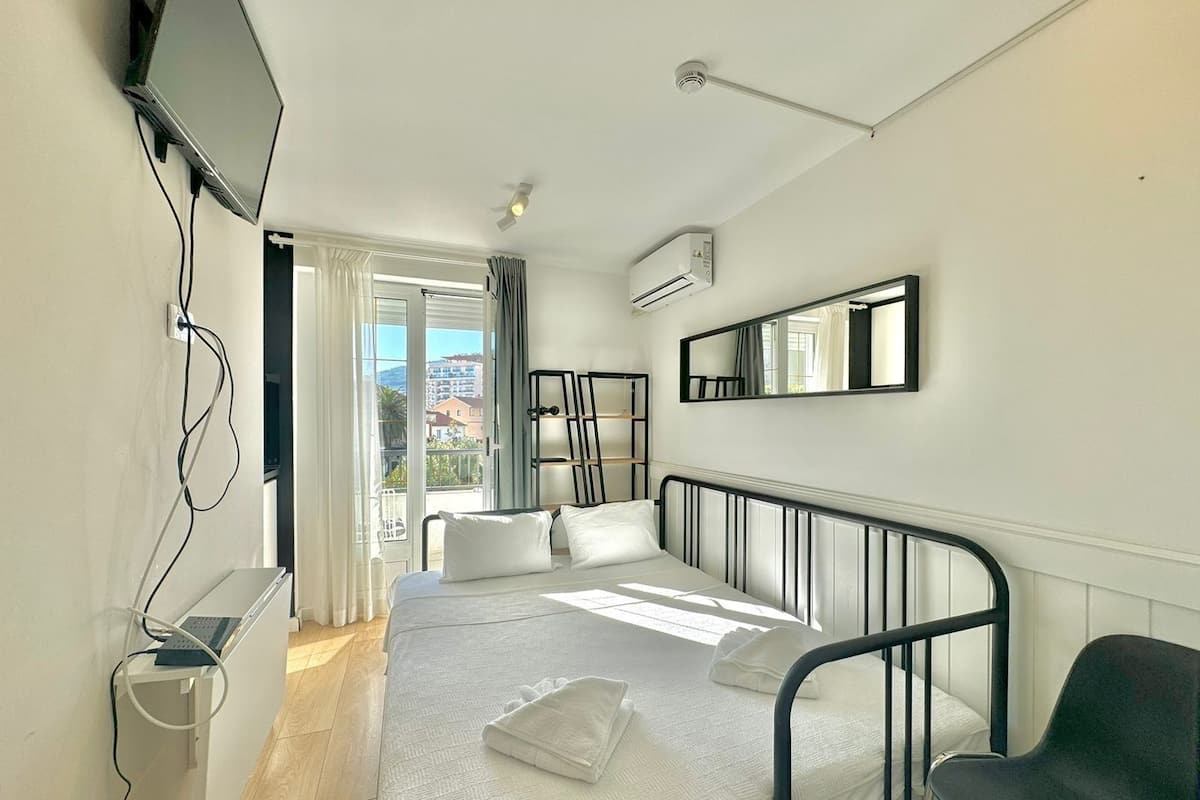 Basic Studio, Balcony | Premium bedding, memory foam beds, soundproofing, iron/ironing board