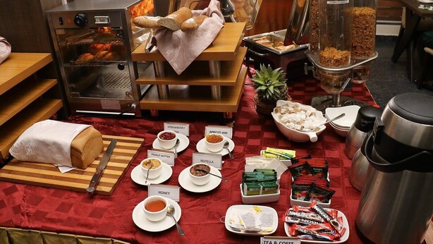 A breakfast buffet with various food items and a coffee machine. - The Grill House & Suites Asokoro Abuja (Abuja)