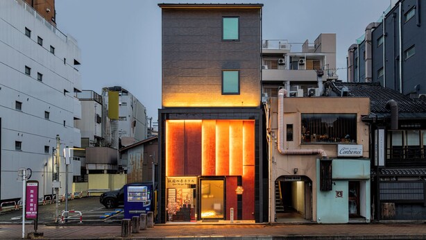 A hotel with a modern facade, large windows, and a prominent entrance.