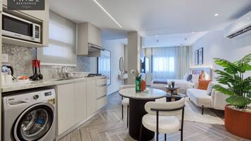 Deluxe Studio | Living area | 45-inch Smart TV with satellite channels