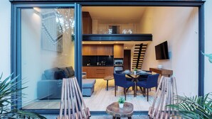 A modern interior with a dining area, kitchen, and seating space. - Welcome to Mistiq Temple II in Tulum, where modern luxury meets the natural beauty of the region (Tulum)