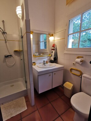 Shower, hair dryer, towels, toilet paper