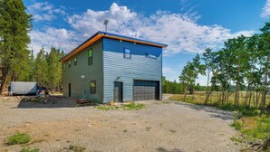 A two-story house with a gravel driveway and a garage. - 3 Mi to Fairplay Beach: Mountain Getaway (Fairplay)
